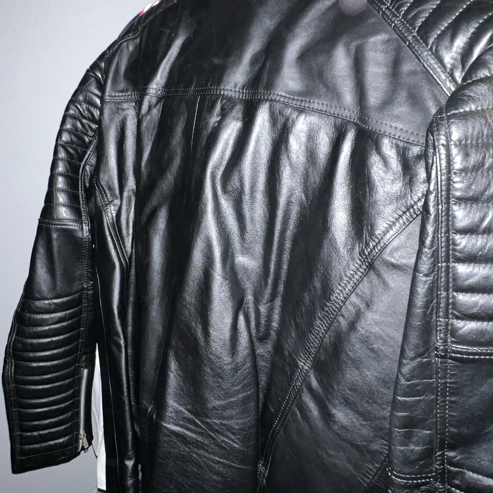 Leather biker jacket color black.